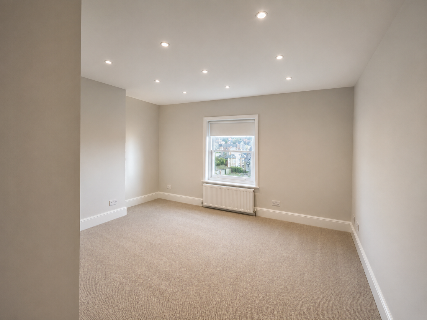 Bedroom renovation with recessed spotlights and high-quality painting and decorating in Surrey